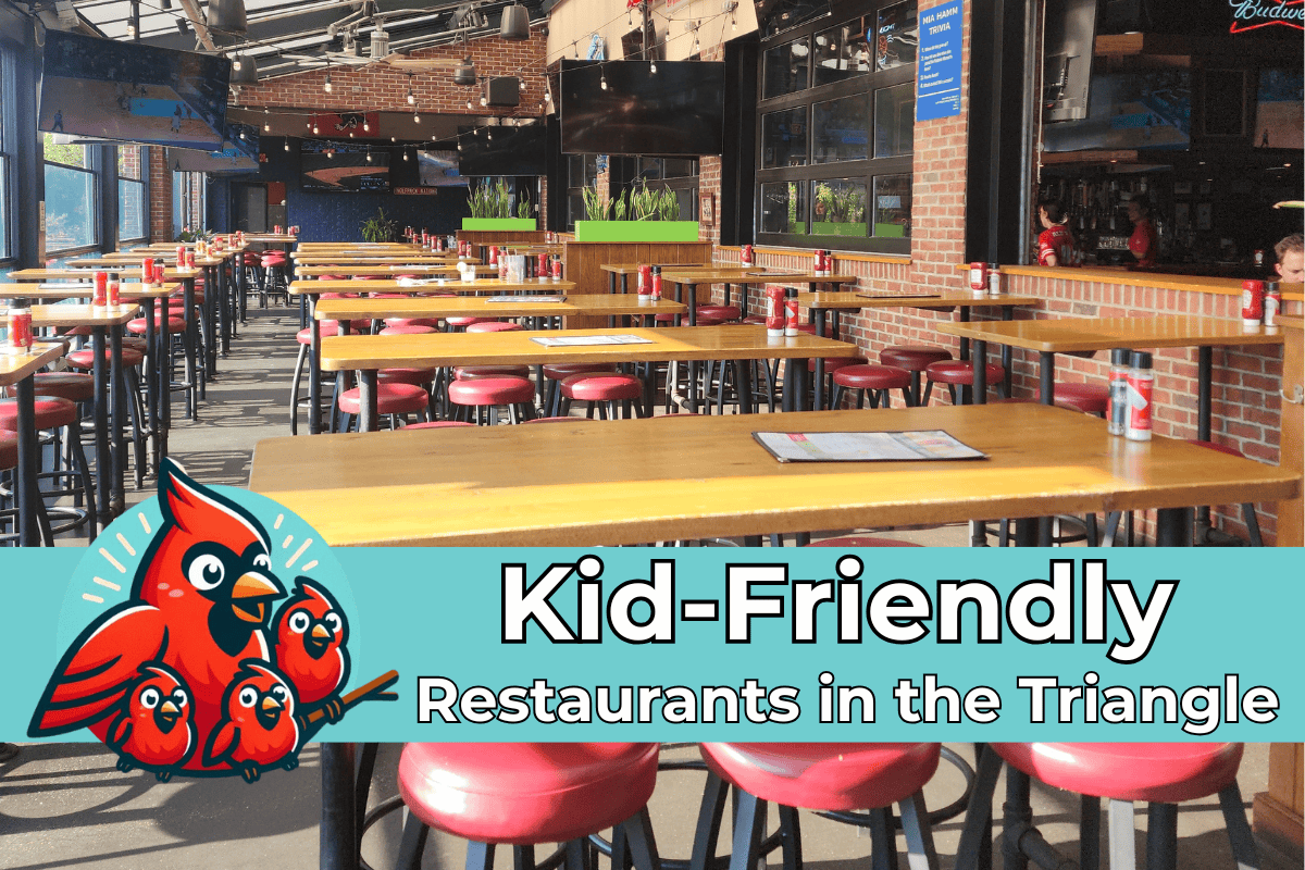 A bright and open restaurant with long wooden tables and red cushioned stools, set against brick walls and large windows. The foreground features a colorful graphic of a red cardinal with three chicks, accompanied by bold text that reads "Kid-Friendly Restaurants in the Triangle."